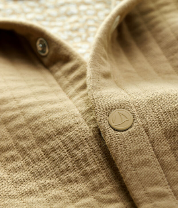 Cardigan beb&egrave; in tubique trapuntato. beige