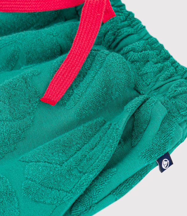 Bermuda corti in cotone tinta unita con stampa bambino verde