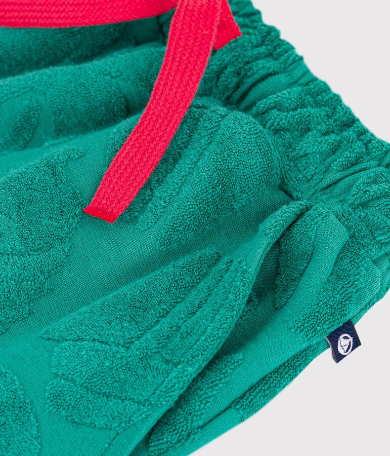 Bermuda corti in cotone tinta unita con stampa bambino verde