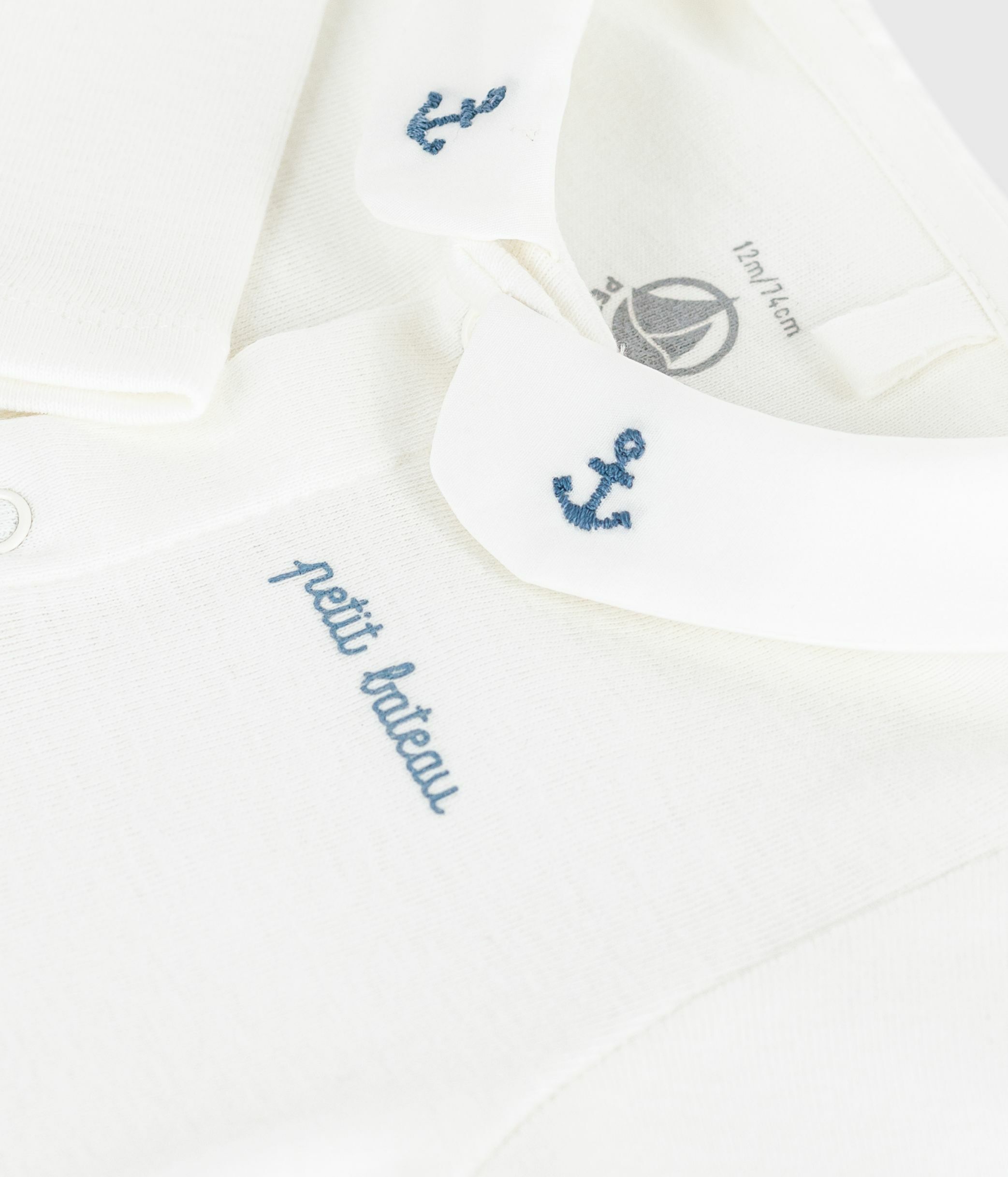 Body con colletto ricamato e scritta sul petto neonato bianco/blu