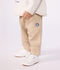 Pantaloni stile cargo in cotone tinta unita con stemma neonato beige